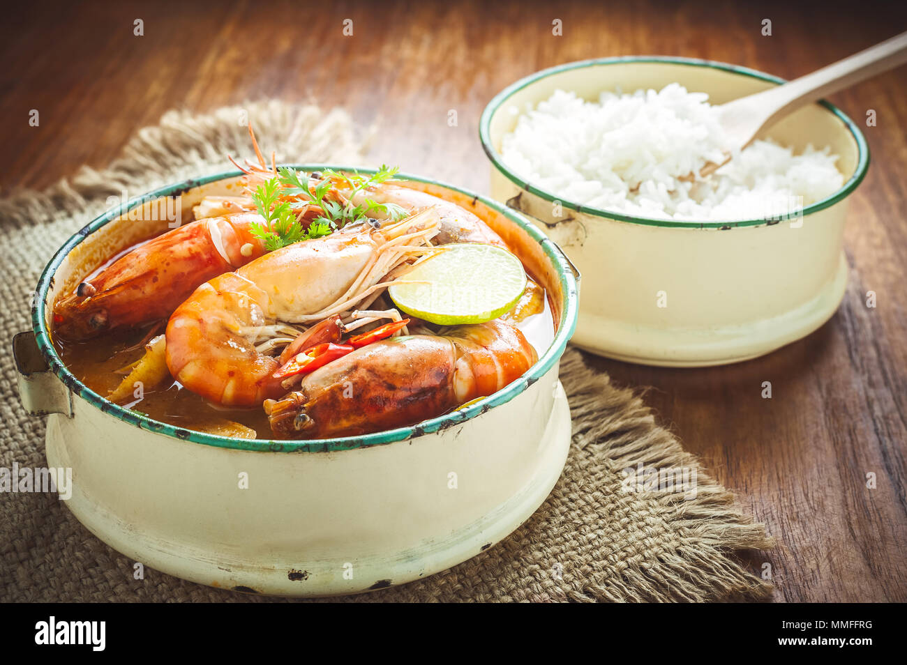 Thai food, River prawn spicy soup or tom yum goong on wooden table Stock Photo