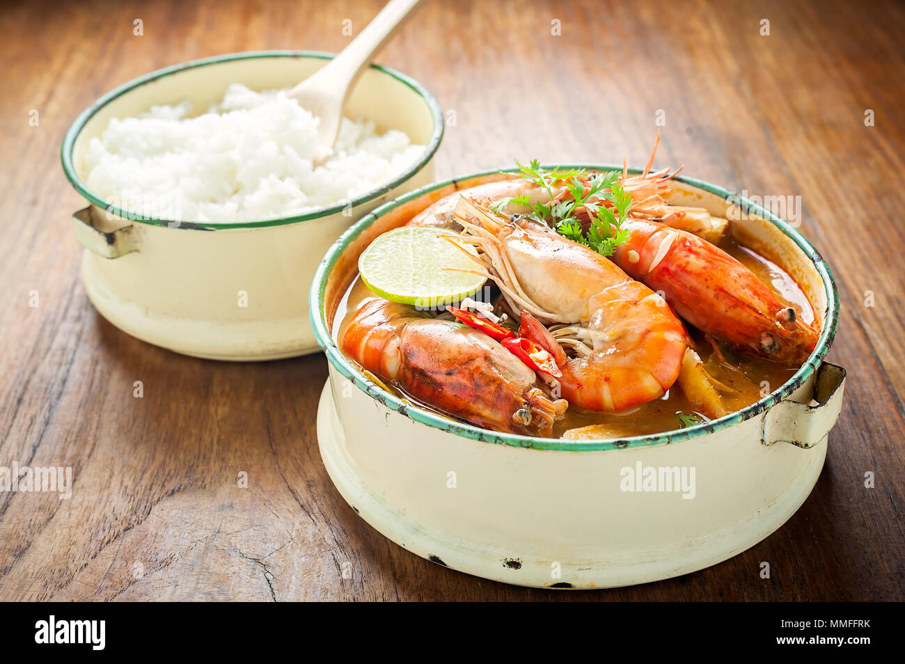 Thai food, River prawn spicy soup or tom yum goong on wooden table Stock Photo