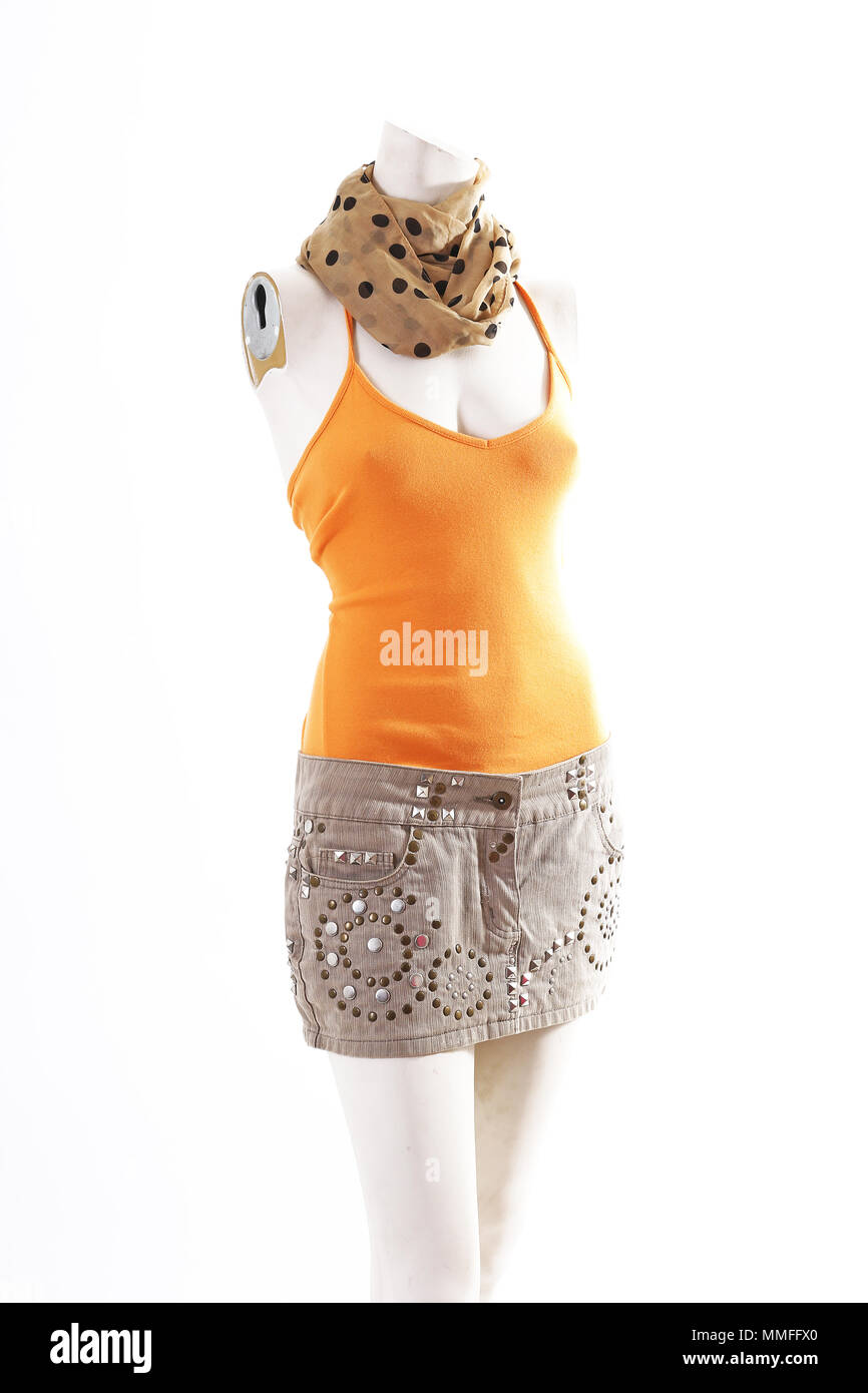 Orange top and beige mini skirt on mannequin full body shop display