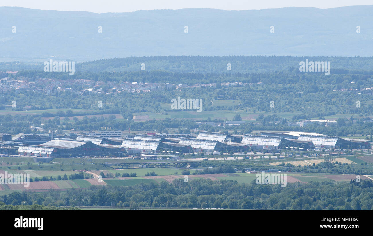08 May 2018, Germany, Stuttgart: Green trees line the perimeters of ...
