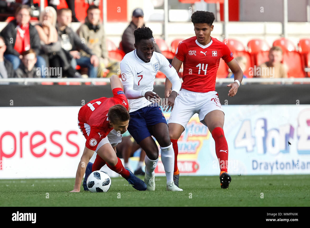 Ilan Sauter of Switzerland, Arvin Appiah of England and Simon Sohm of Switzerland during the 2018 UEFA European Under-17 Championship Group A match between Switzerland and England at New York Stadium on May 10th 2018 in Rotherham, England. (Photo by Daniel Chesterton/phcimages.com) Stock Photo