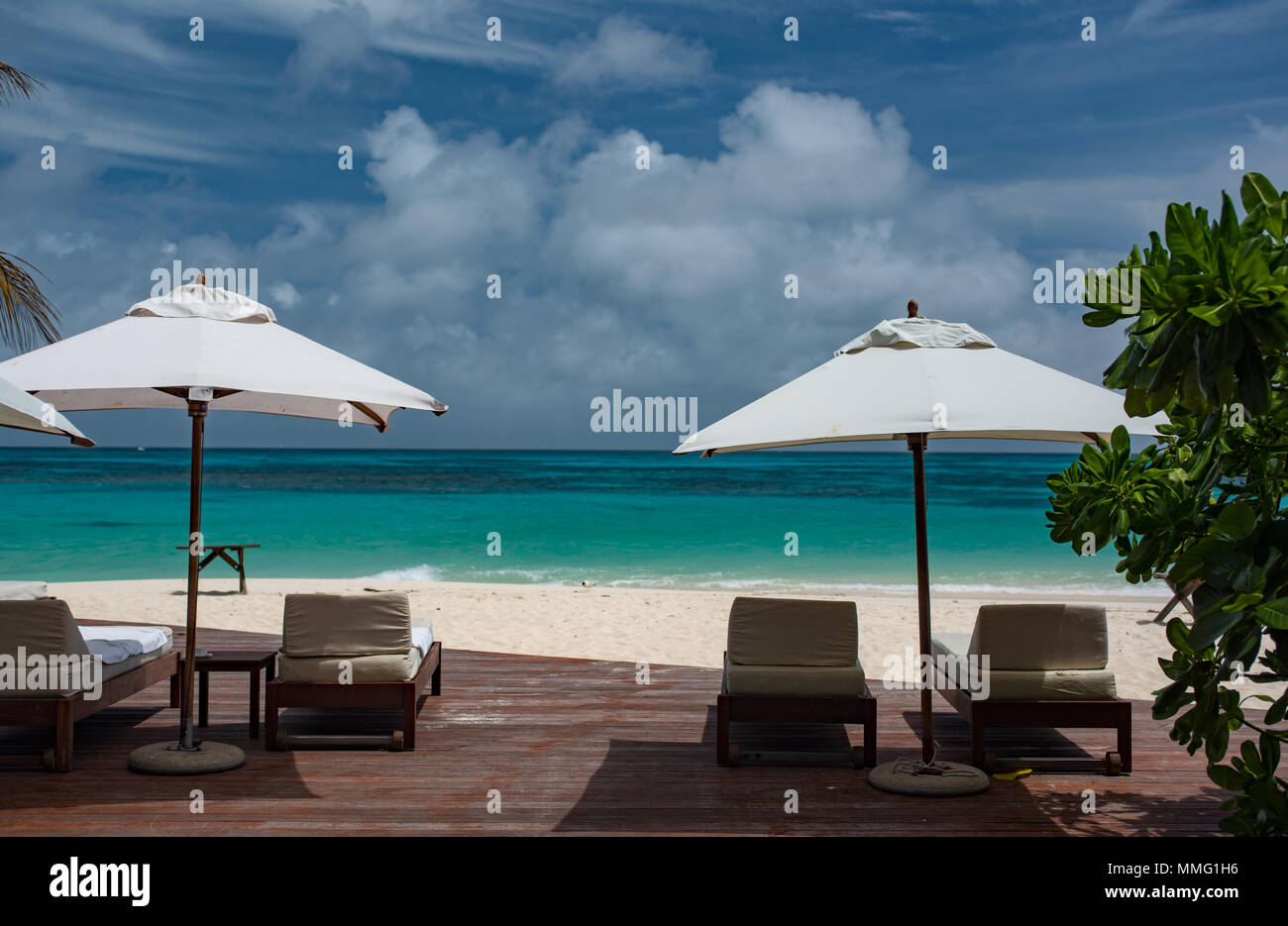 Sun loungers overlooking the Indian Ocean at Denis Island in the Seychelles Stock Photo Alamy