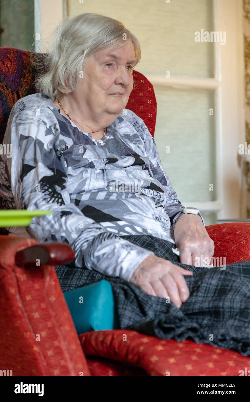 11 May 2018 Old lady suffering from Dementia sits alone with her bare