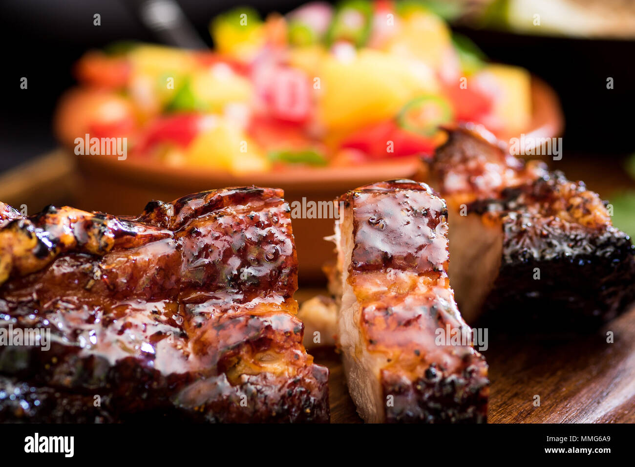 Jamaican Jerk Pork Belly with Mango Salsa Stock Photo