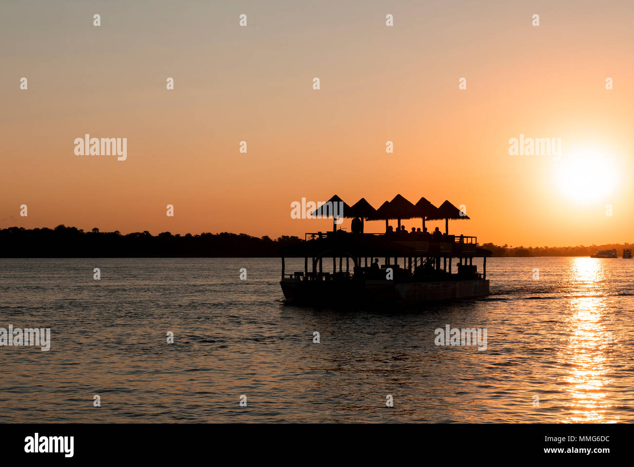 Africa, Zimbabwe, Zambezi River, near Victoria Falls. Sunset sightseeing cruise on the Zambezi River. Stock Photo