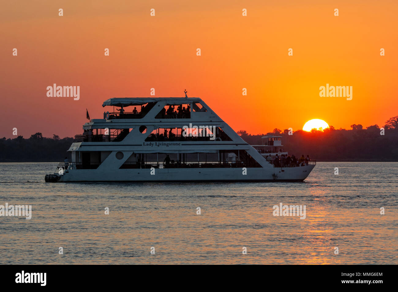 Africa, Zimbabwe, Zambezi River, near Victoria Falls. Sunset sightseeing cruise boat, Lady Livingstone, on the Zambezi River. Stock Photo