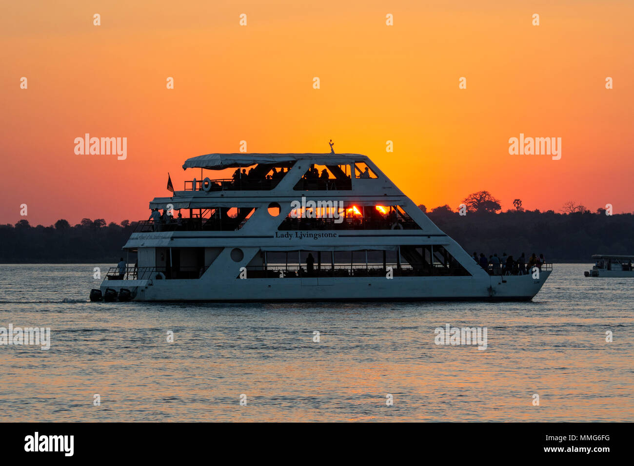 Africa, Zimbabwe, Zambezi River, near Victoria Falls. Sunset sightseeing cruise on the Zambezi River. Stock Photo