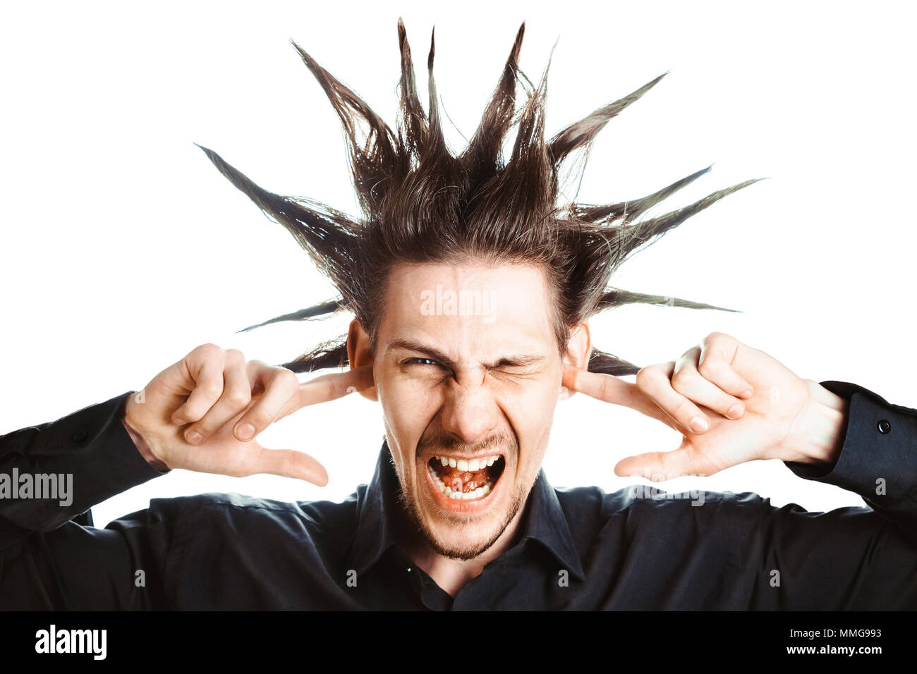 A young man with a Mohawk on his head covers his ears Stock Photo Alamy