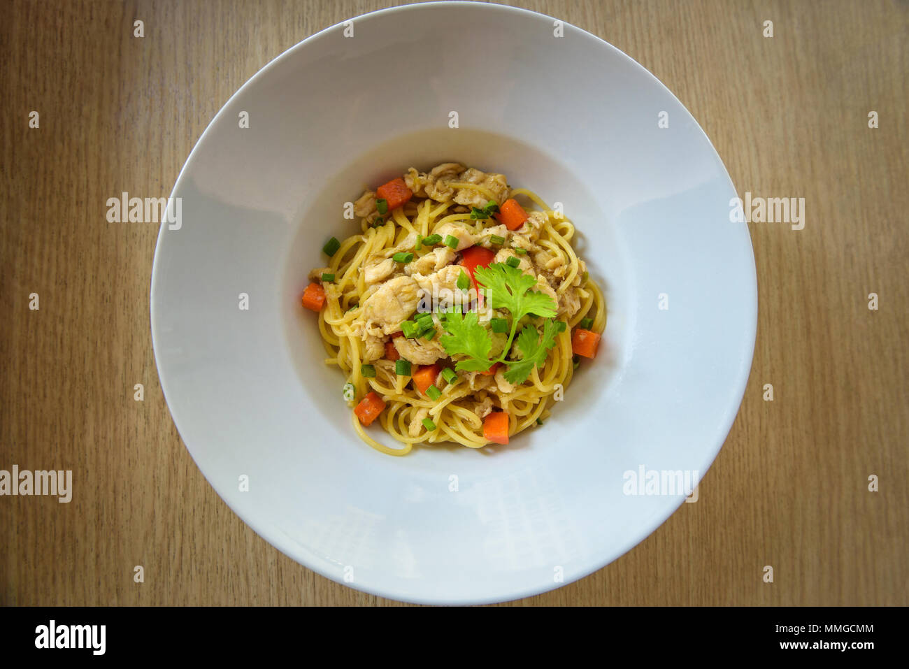 Stir-fried noodles with chicken Stock Photo