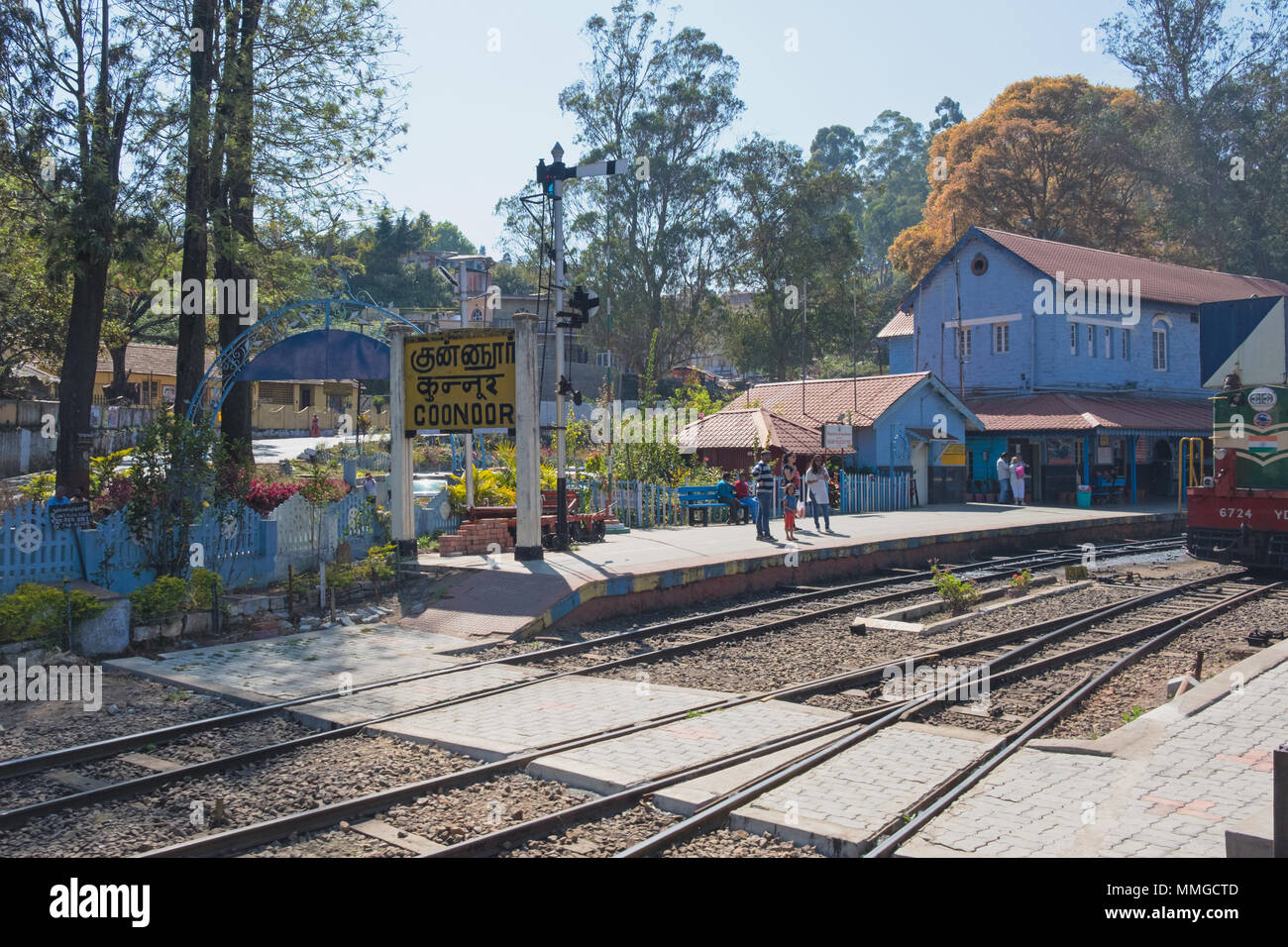 Coonoor, India - March 4, 2018: Scene at Coonoor station on the Nilgiri Mountain Railway, a Unesco World Heritage site built by the British in 1908 Stock Photo