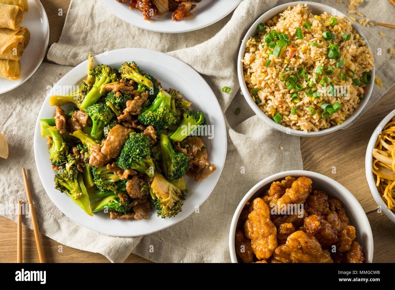 Spicy Chinese Take Out Food with Chopsticks and Fortune Cookies Stock Photo