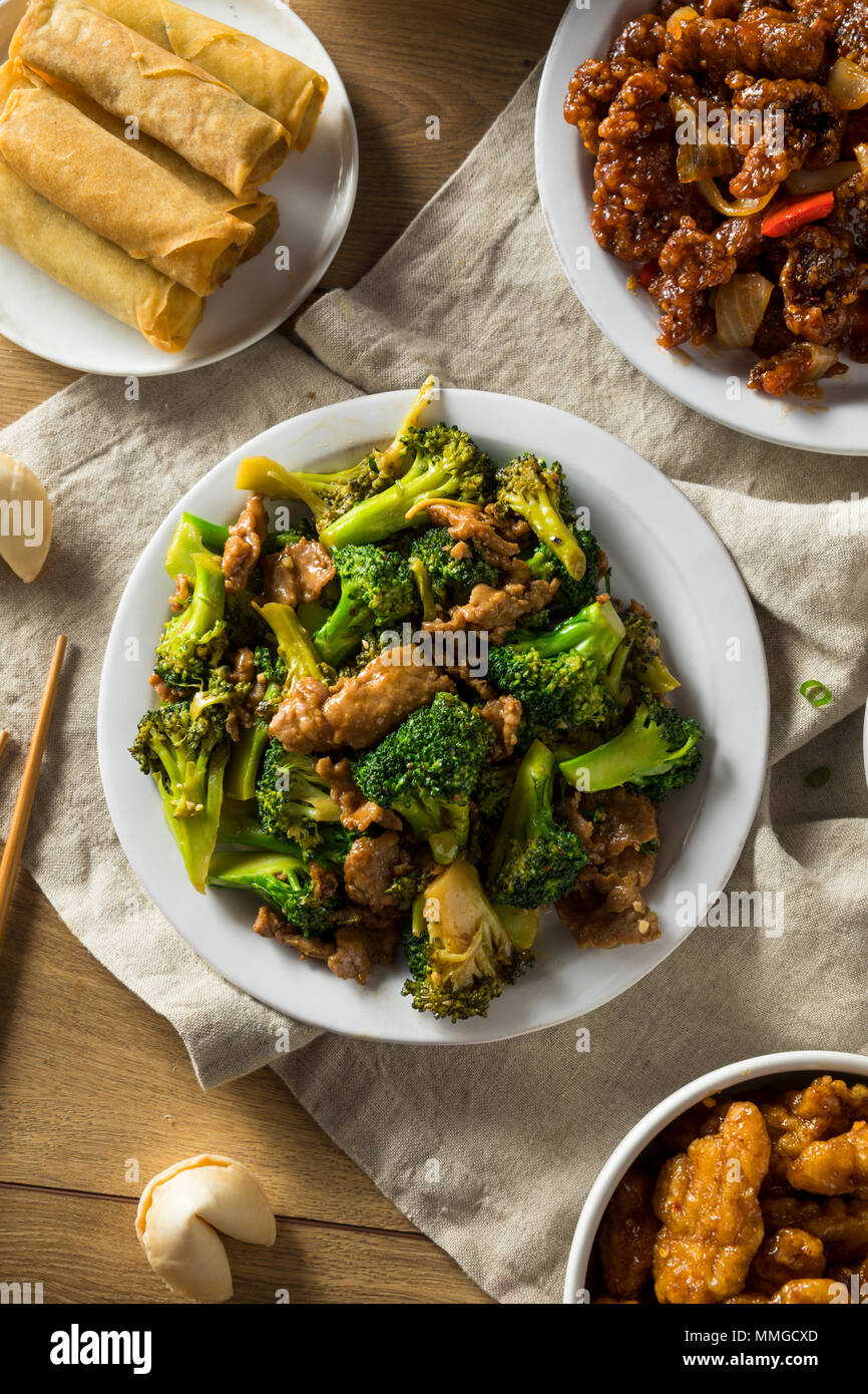 Spicy Chinese Take Out Food with Chopsticks and Fortune Cookies Stock