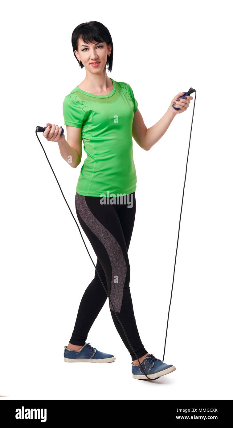 girl posing with skipping rope in studio, isolate on white background ...