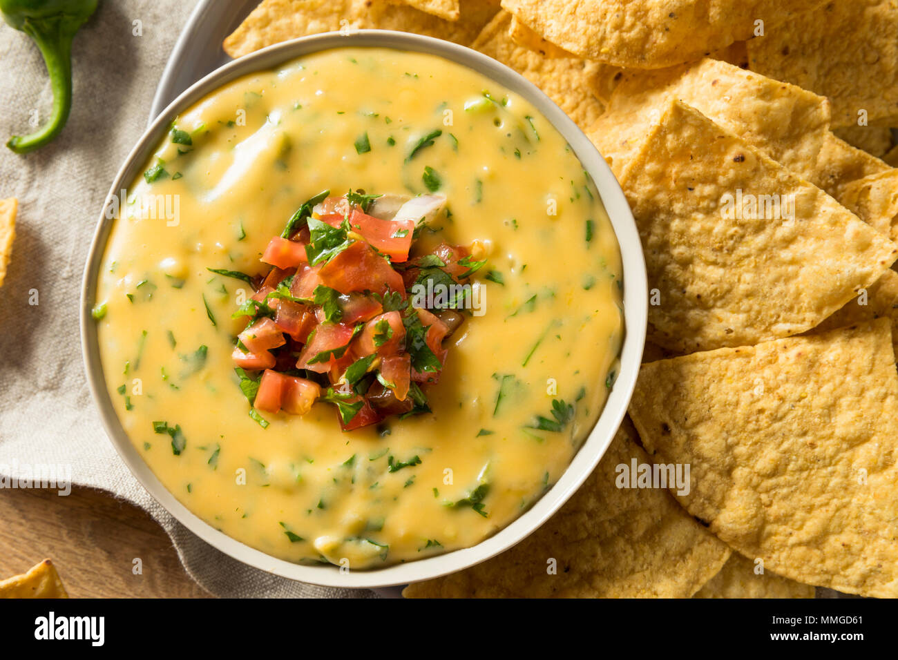 Spicy Homemade Cheesey Queso Dip with Tortilla Chips Stock Photo - Alamy