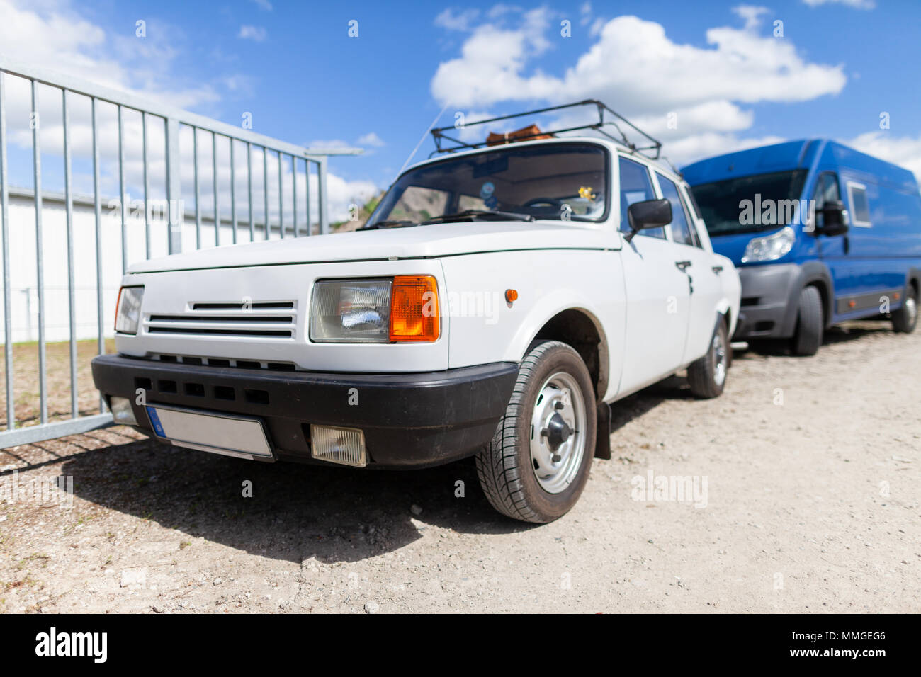 White german oldtimer car stands on gravel road Stock Photo