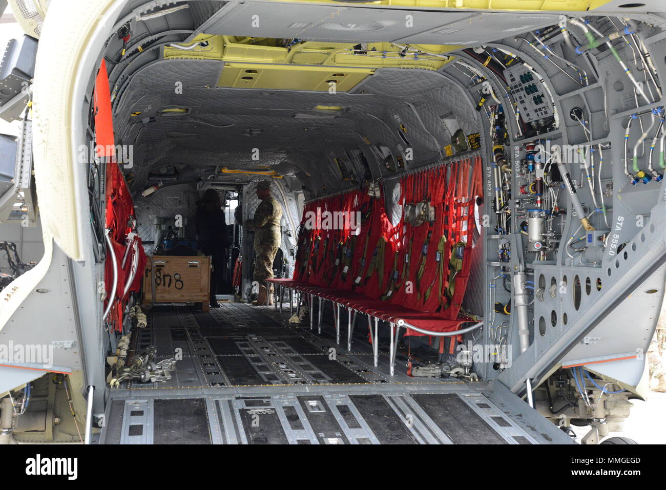Soldiers show people the inside of a CH-47 Chinook helicopter ...
