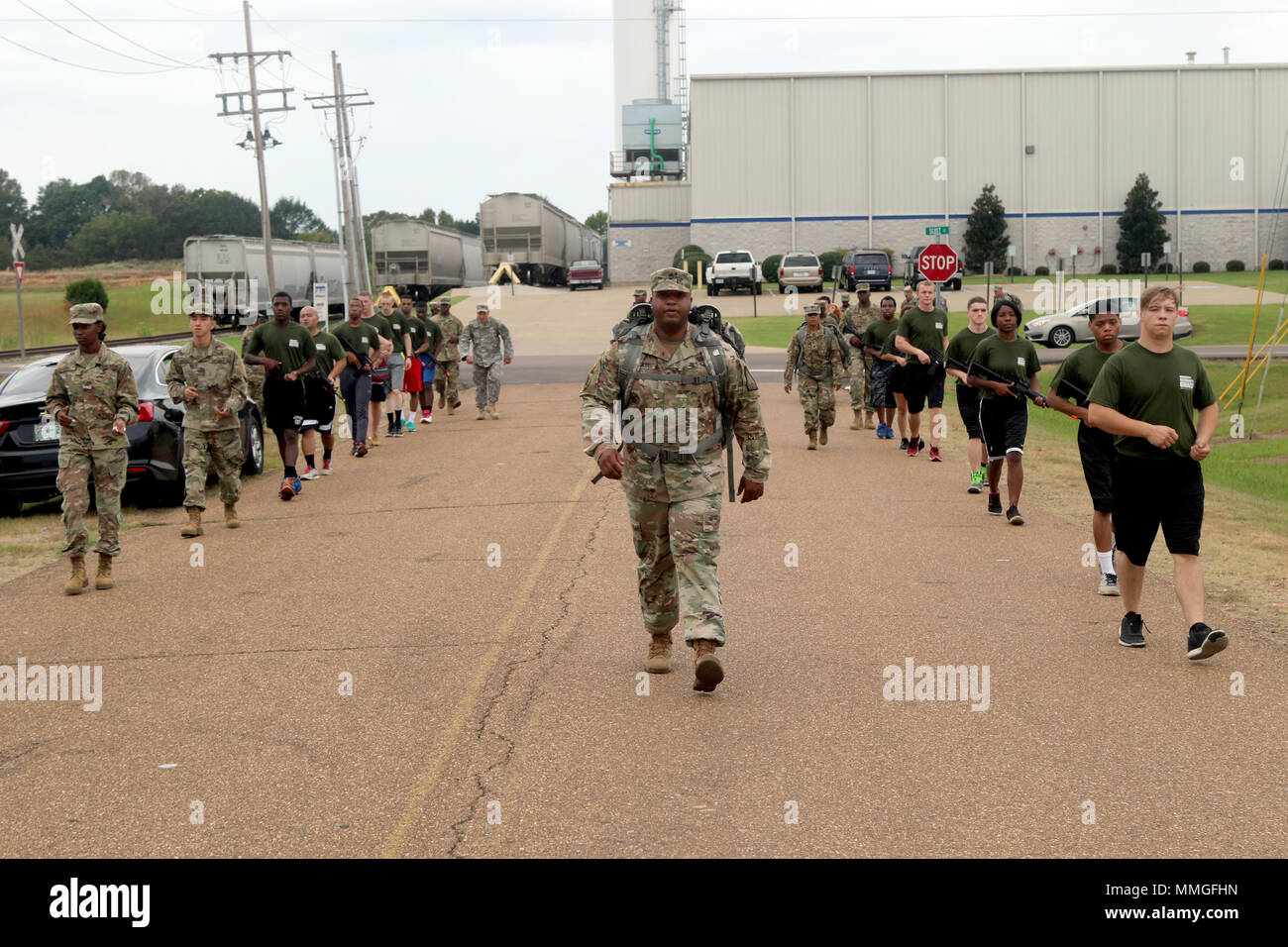 Sgt. 1st Class Sylvester Brookins, a drill sergeant with the Mississippi National Guard Recruiting and Retention Battalion, leads the warriors of the Senatobia Recruit Sustainment Program during a road march Oct. 7, 2017. Warriors in the RSP drill each month while preparing for basic training. (U.S. National Guard photo by Staff Sgt. Scott Tynes) Stock Photo