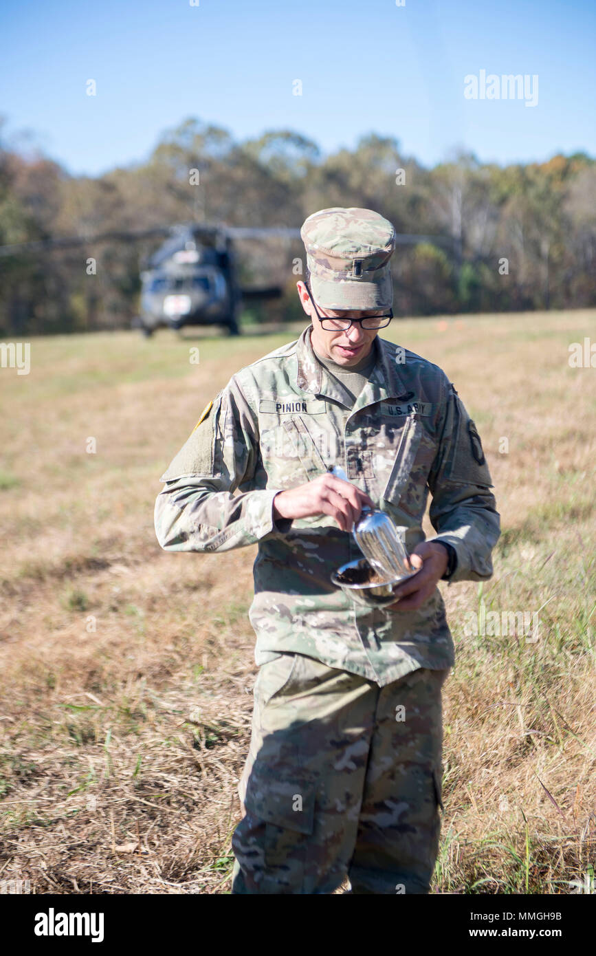 1st Lt. Jacob Pinion, an environmental science officer with 526 Brigade Support Battalion, 2nd Brigade Combat Team, 101st Airborne Division (Air Assault), takes a soil sample during a field exercise October 26, 2017. The field exercise was a culminating event for a preventative medicine health course that focused on expanding the skillset of medics and reviewed topics for brigade preventive medicine teams. Participants were broken down into three teams, with each team working to solve a different scenario involving either air, water or soil. (U.S. Army photo by Sgt. Samantha Stoffregen, 101st  Stock Photo