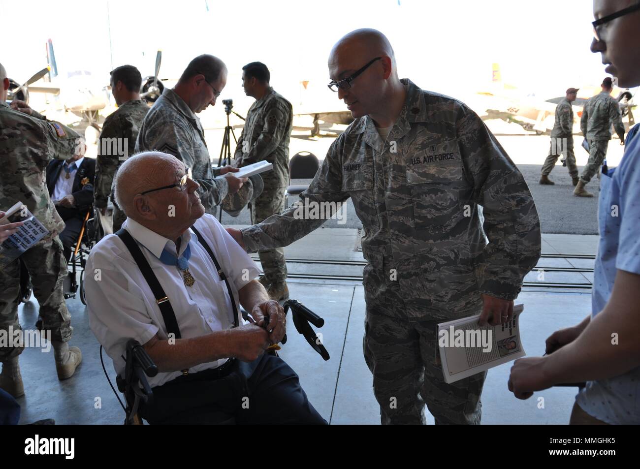 Maj. (Dr.) Spencer Hamner, 302nd Aeromedical Staging Squadron, right, shakes hands with U.S. Army Command Sgt. Maj. (Ret.) Bennie Adkins during the Congressional Medal of Honor Society 2017 Convention Sept. 16, here. Adkins received his medal for his actions during an attack on his camp during the Vietnam War from March 9 to 12 in 1966. Approximately 40 Medal of Honor recipients gathered in Pueblo, Colorado for their annual convention and met with groups from the U.S. Air Force Academy, Fort Carson and Peterson Air Force Base, among others. (U.S. Air Force photo/Daniel Butterfield) Stock Photo