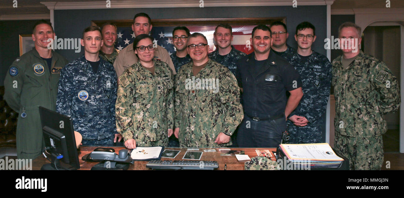 NORFOLK, Va. (May 7, 2018) -- Sailors assigned to USS Gerald R. Ford's (CVN 78) media department pose for a picture with Capt. Richard McCormack (far right), Ford's commanding officer, and Capt. Brent Gaut (far left), Ford's executive officer, after a promotion ceremony held onboard. Media departments divisional officer, Lt. j.g. Corey T. Jones was promoted to his current rank in today's ceremony. (U.S. Navy photo by Mass Communication Specialist 3rd Class Liz Thompson) Stock Photo
