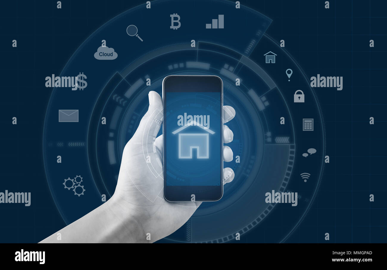Smart home and buildings mobile application. Hand holding mobile smart phone Stock Photo