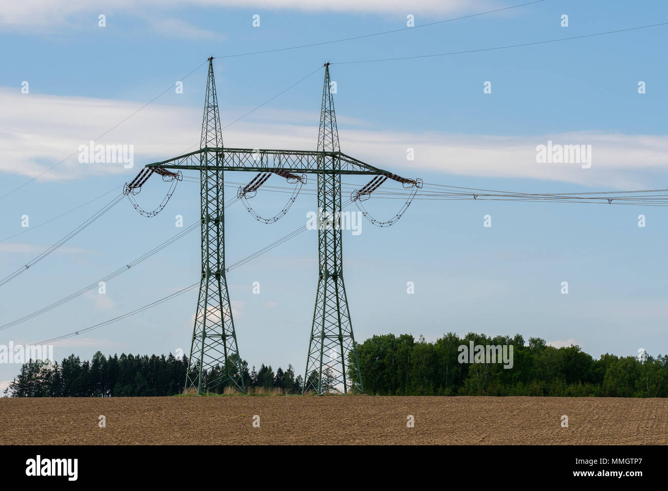 High voltage power lines with blue sky Stock Photo - Alamy