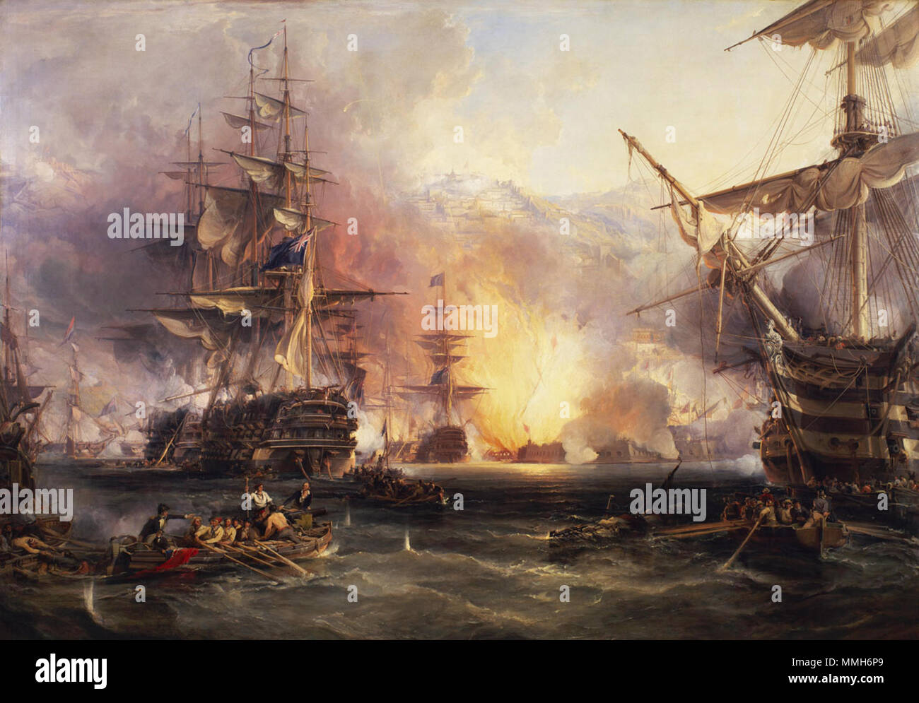 .  English: In the foreground of the painting is a barge with a howitzer in the bows and a lieutenant standing at her tiller. To the left of her are two boats, one sunk and the other with sailors rescuing the crew. In the right foreground is a fallen spar and another barge with a carronade in her bow. Beyond her more boats are sheltering under the 'Impregnable', 98 guns, the fore part of whose bow is in the picture. In the left middle distance there are three more boats under the stern of the 'Minden', 74 guns, one of which is about to fire a Congreve rocket. The 'Minden', in port-quarter view Stock Photo