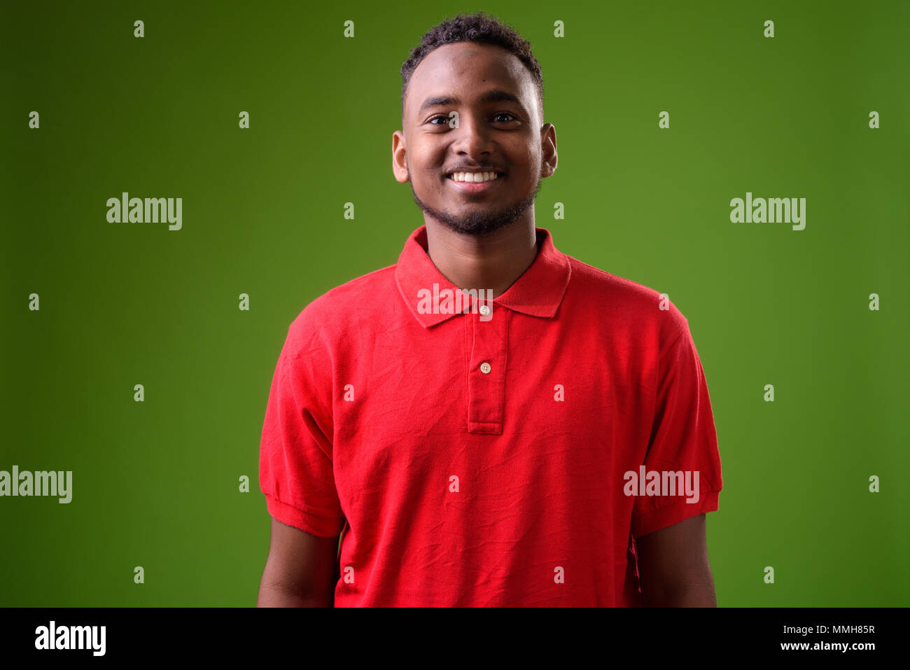 Young black african guy red hi-res stock photography and images - Alamy