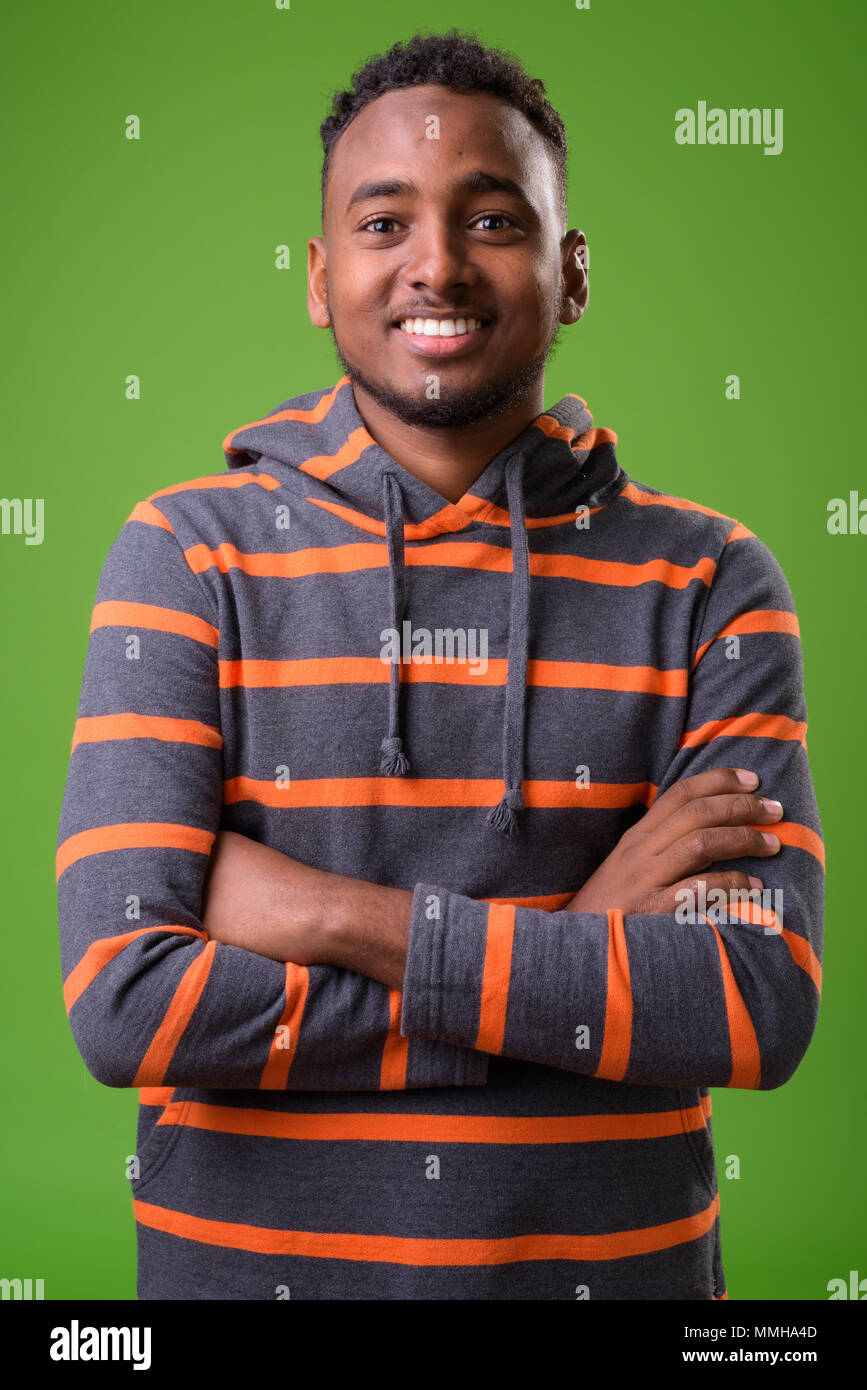 Young happy african man arms hi-res stock photography and images - Alamy