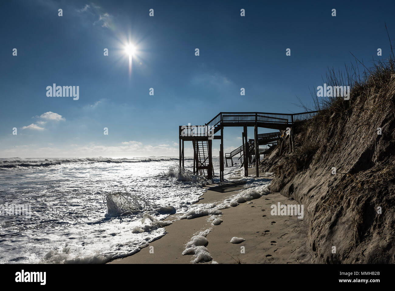 Beach steps surrounded by high tide surf, Nags Head, Outer Banks, North Carolina, USA Stock Photo