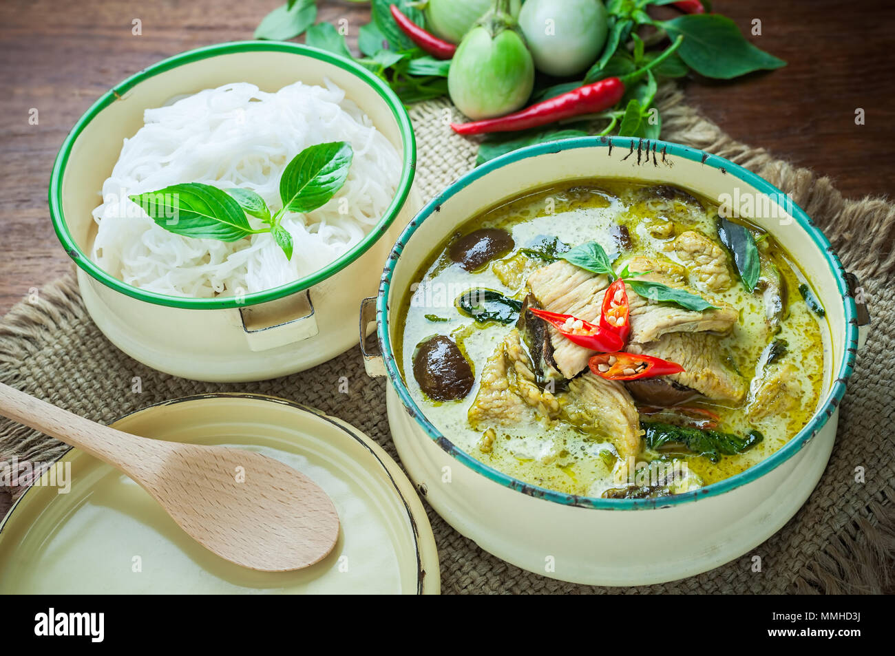 Thai food green curry chicken on wooden background Stock Photo - Alamy