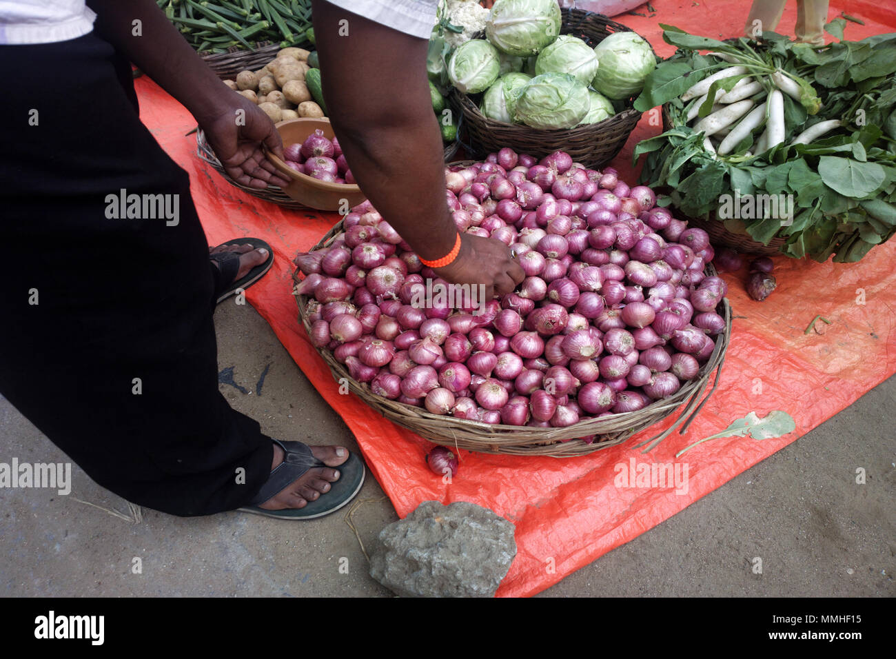 Vegetables and fruits in Indian Bazaar. Blue bulb onion, red onion