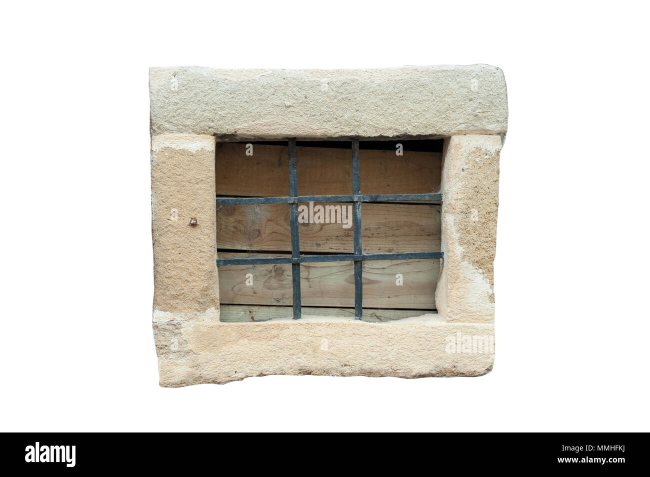 Small stone frame window with black metal bars isolated on white