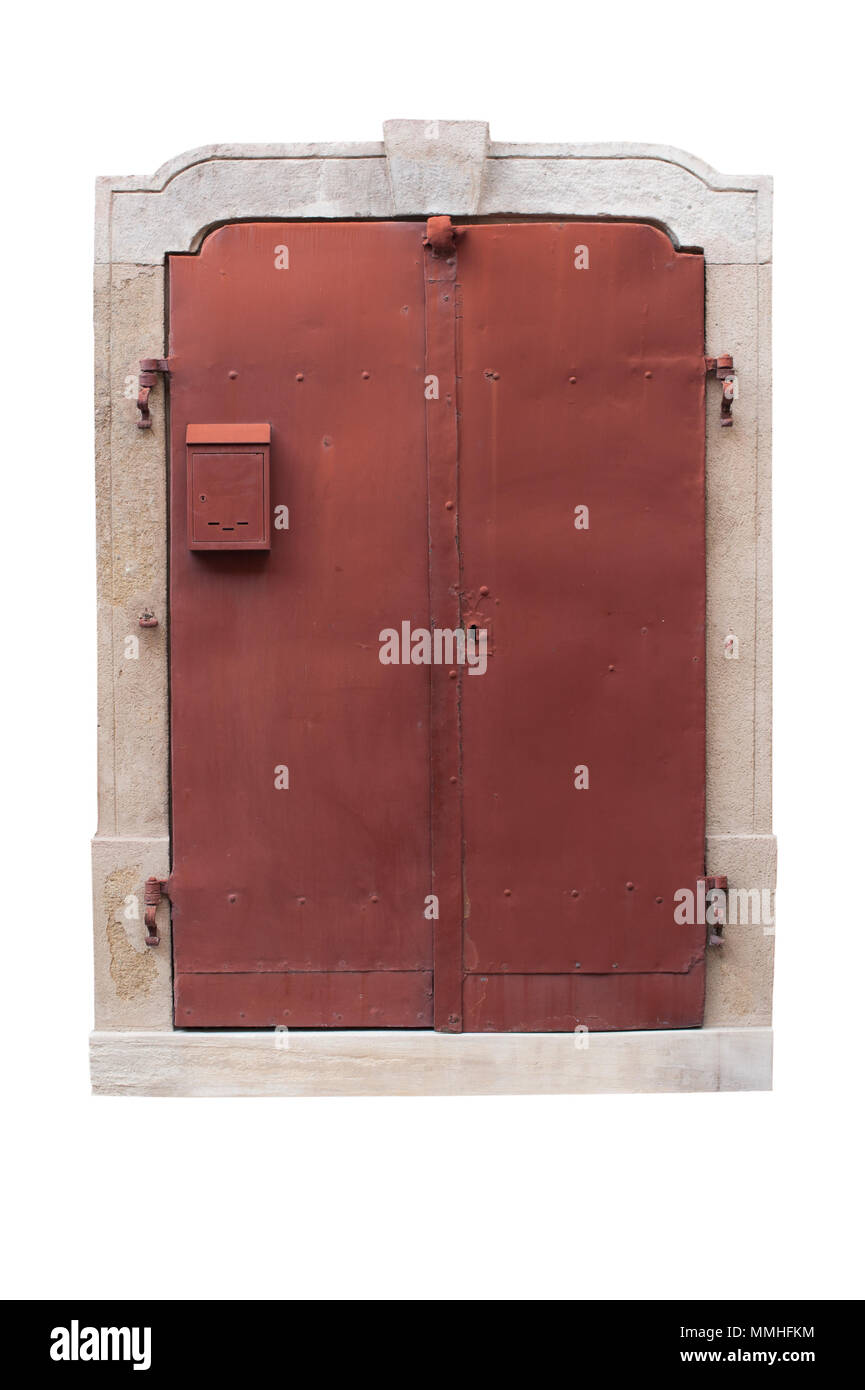 Old metal red doors with stone arch isolated on white background. Red metal doors with small mailbox. Exterior design. Path saved. Stock Photo