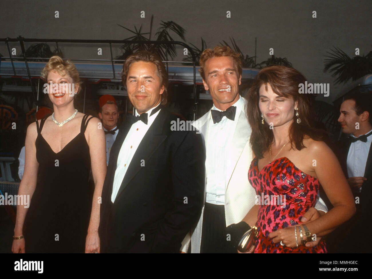BURBANK, CA - JUNE 02: (L-R) Actress Melanie Griffith, actor Don Johnson, actor Arnold Schwarzenegger and Maria Shriver attend Warner Bros. Studio Rededication event at Warner Bros. Studios on June 2, 1990 in Burbank, California. Photo by Barry King/Alamy Stock Photo Stock Photo