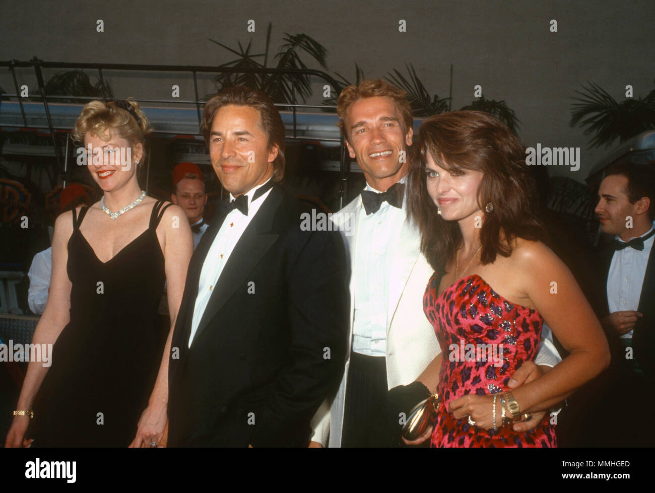 BURBANK, CA - JUNE 02: (L-R) Actress Melanie Griffith, actor Don Johnson, actor Arnold Schwarzenegger and Maria Shriver attend Warner Bros. Studio Rededication event at Warner Bros. Studios on June 2, 1990 in Burbank, California. Photo by Barry King/Alamy Stock Photo Stock Photo