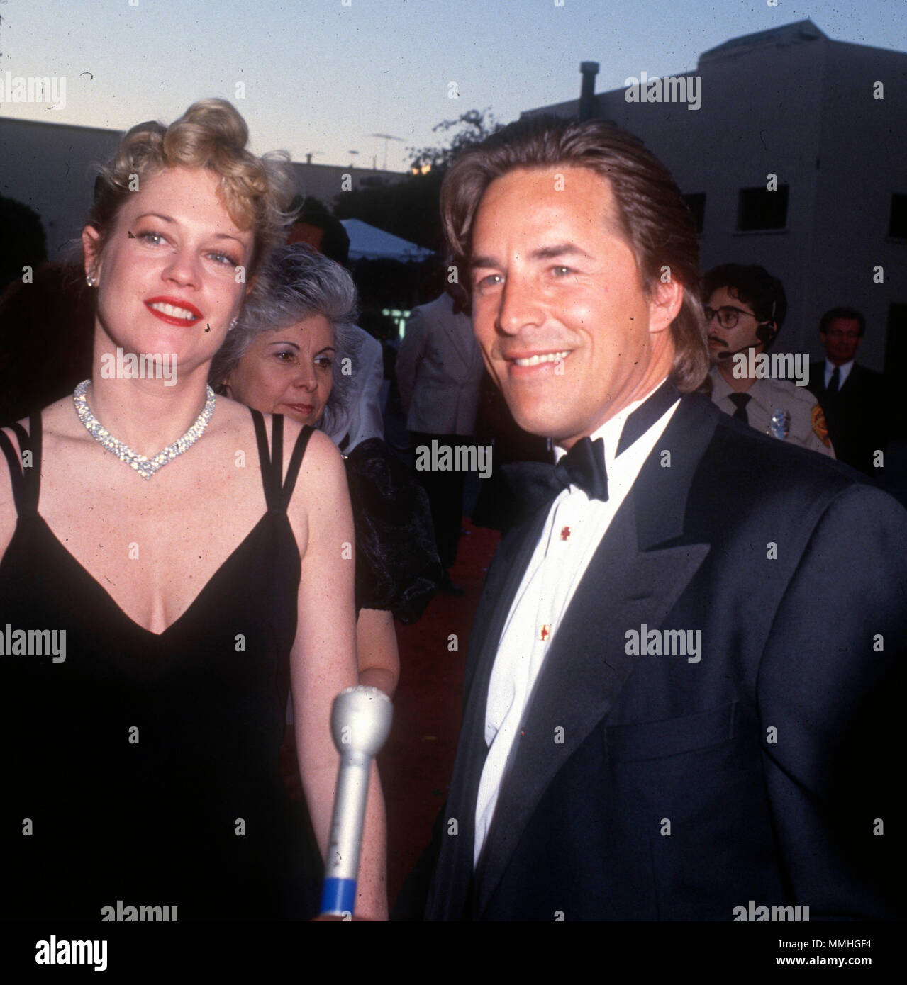 BURBANK, CA - JUNE 02: (L-R) Actress Melanie Griffith, and actor Don Johnson attend Warner Bros. Studio Rededication event at Warner Bros. Studios on June 2, 1990 in Burbank, California. Photo by Barry King/Alamy Stock Photo Stock Photo