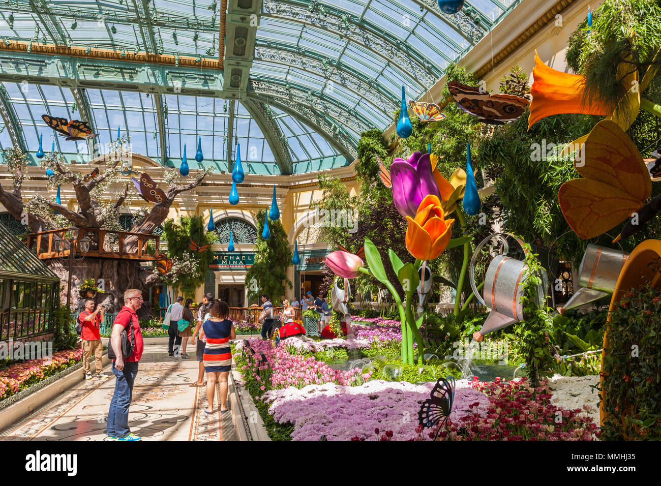 Tourists visiting Bellagio's Conservatory & Botanical Gardens in the Bellagio Luxury Resort and Casino on the Las Vegas Strip in Paradise, Nevada Stock Photo