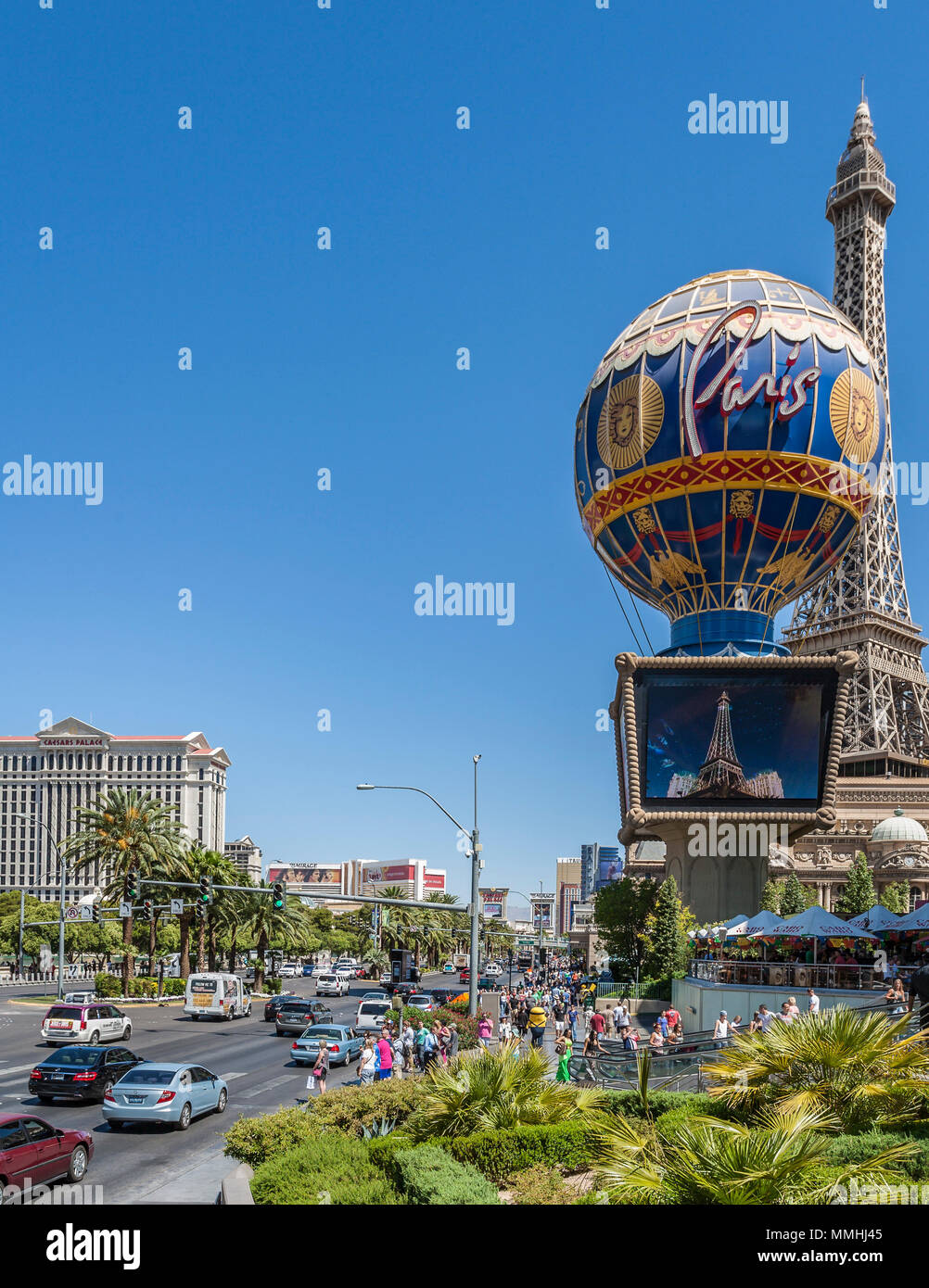 Crowds of tourists and vehicles on Las Vegas Boulevard on the Las Vegas Strip in Paradise, Nevada Stock Photo