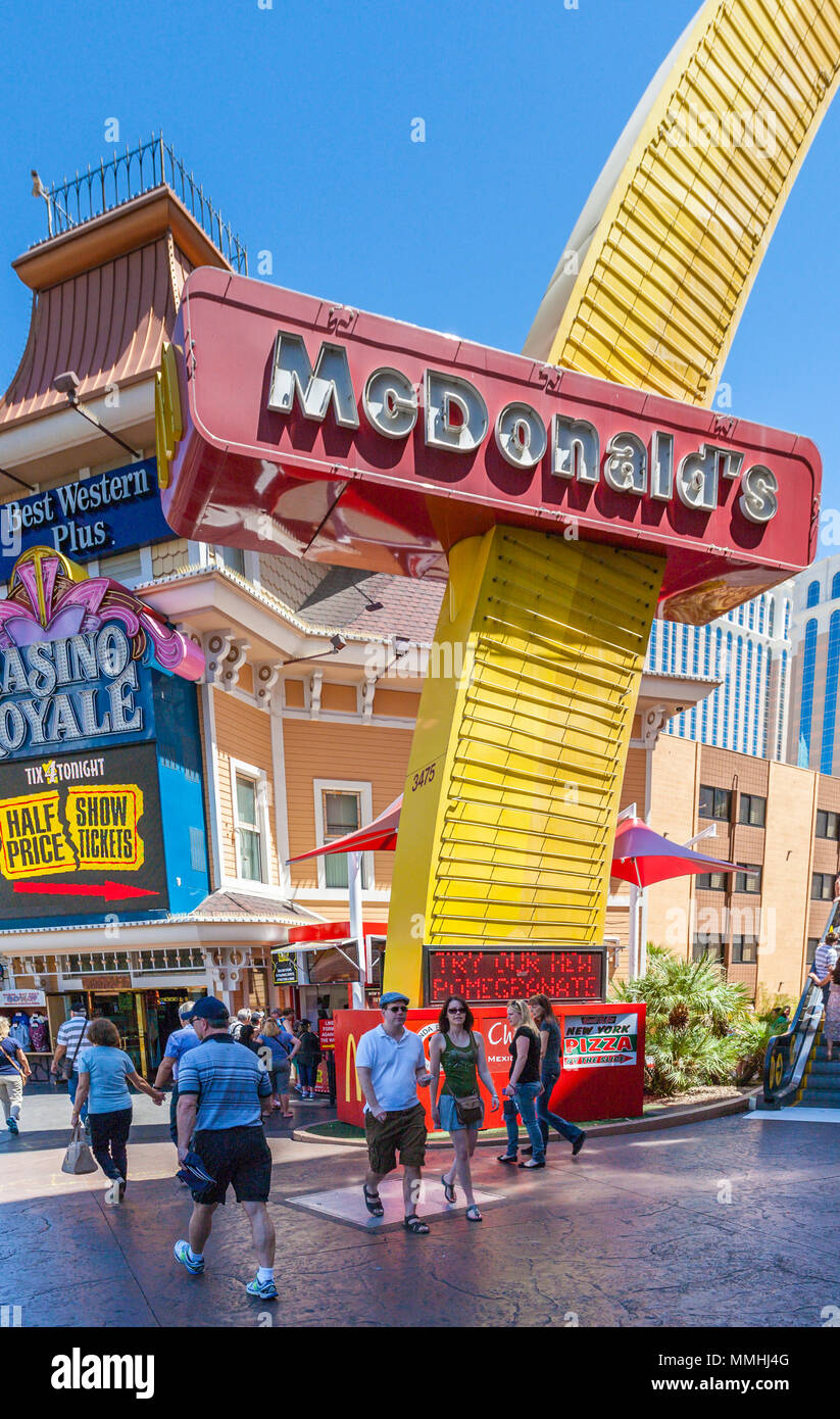Tourists walking past the McDonald's trademark golden arches on the Las  Vegas Strip in Paradise, Nevada Stock Photo - Alamy