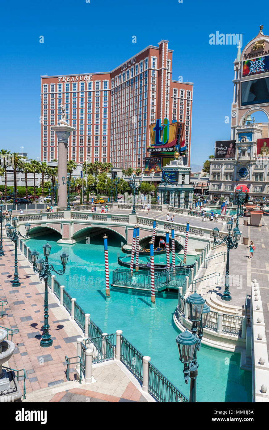 Treasure Island hotel and casino rises up beyond the pools of the Venetian  resort on the Las Vegas Strip in Paradise, Nevada Stock Photo - Alamy