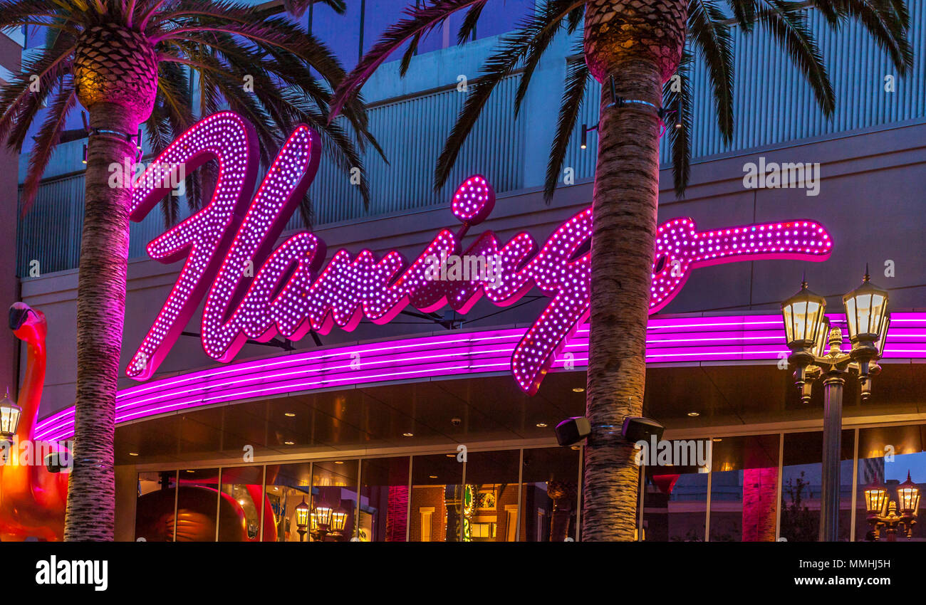 Purple and pink neon lights of the Flamingo Las Vegas Hotel and Casino on the Las Vegas Strip in Paradise, Nevada Stock Photo