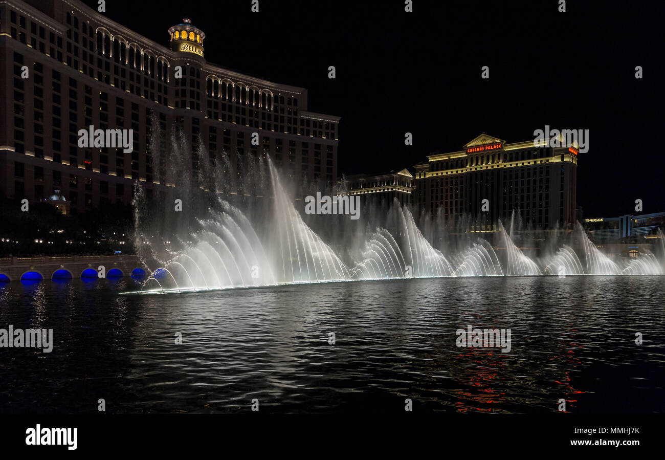 The famous Fountains of Bellagio water show set to music and dramatically lit at night Stock