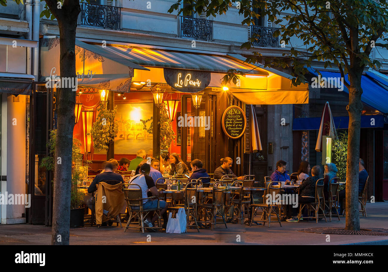 Typical Parisian cafe Le Parvis at night located next famous Notre Dame ...