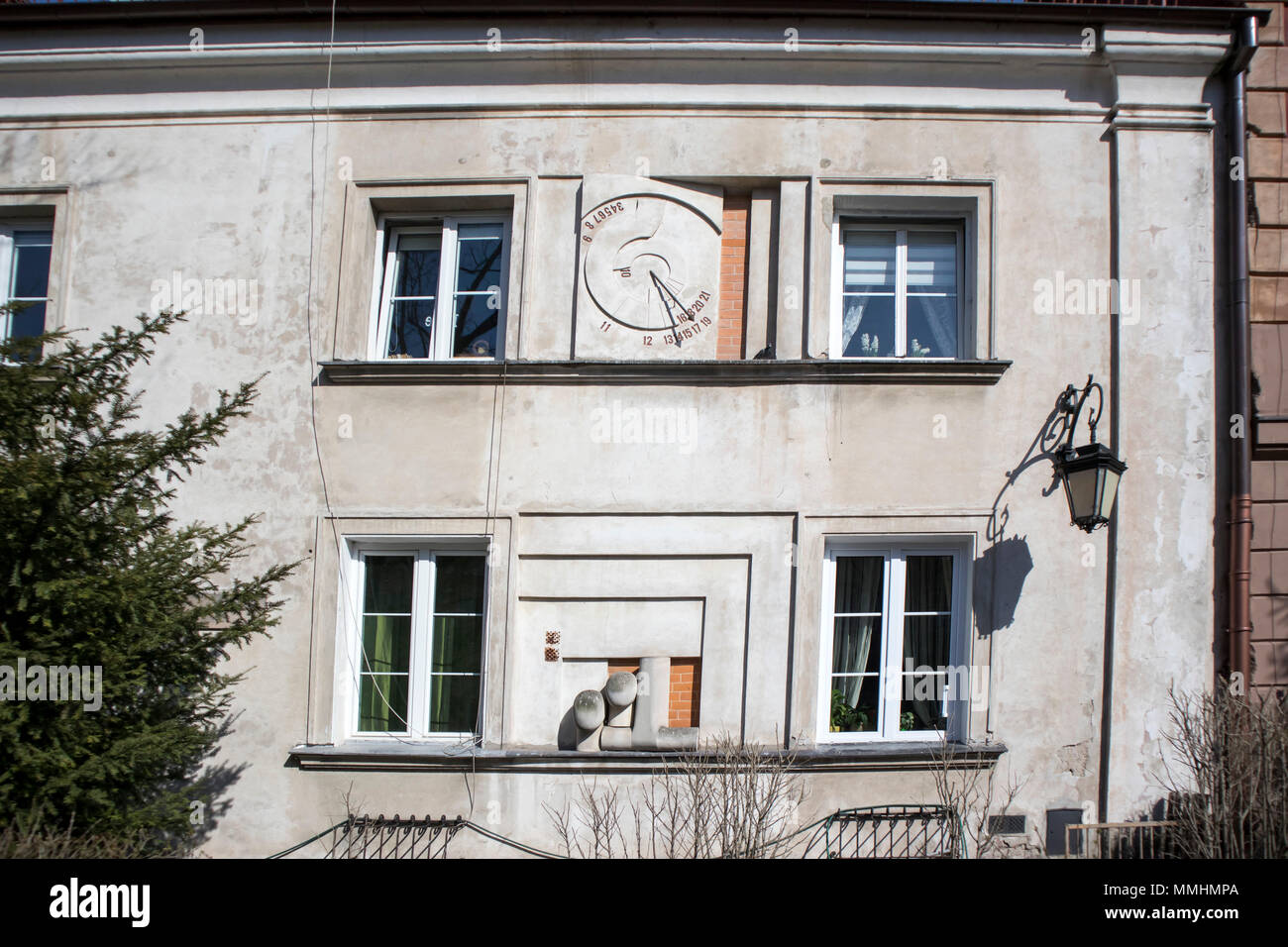 WARSAW, POLAND - APRIL 28, 2018: Ancient sundial on the external wall of building in Warsaw Stock Photo