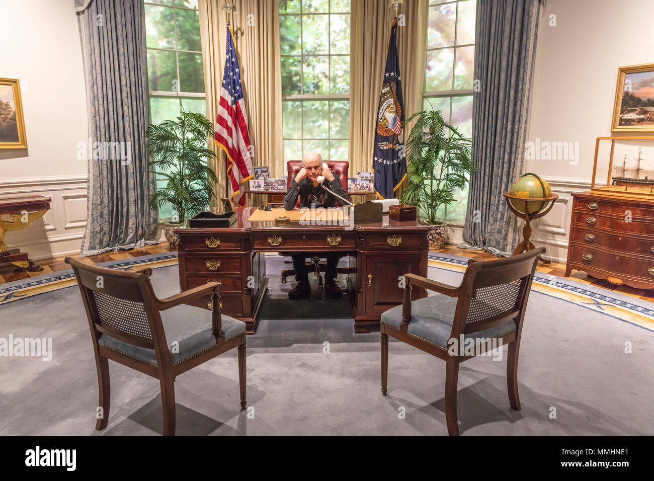 FEBRUARY 28, 2018 - COLLEGE STATION TEXAS - George H.W. Bush Presidential Library and Museum shows Oval Office shows photographer Joe Sohm sitting at Oval Office Desk Stock Photo