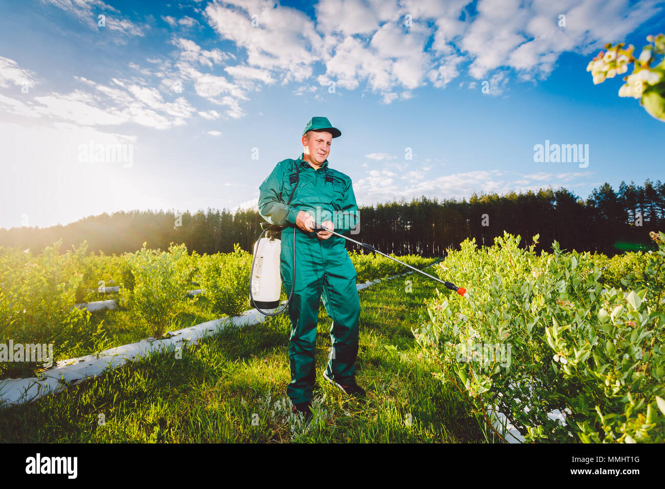 Ukraine, Kiev region June 2, 2017 Agricultural worker in green uniform