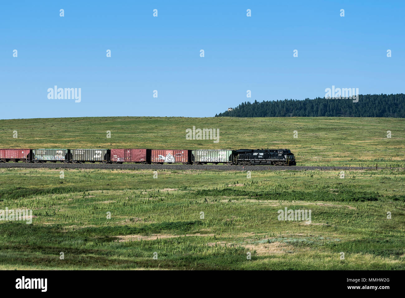 Train transports cargo through the Colorado landscape. Stock Photo