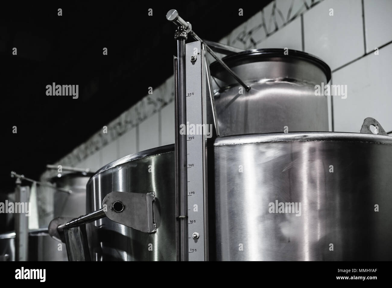 Steel barrels in a row, wine factory equipment Stock Photo Alamy
