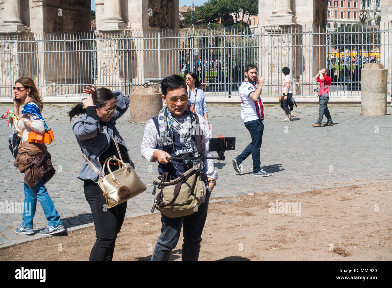 Rome, Italy, 2018 - Tourists couple  next to Colosseum Stock Photo